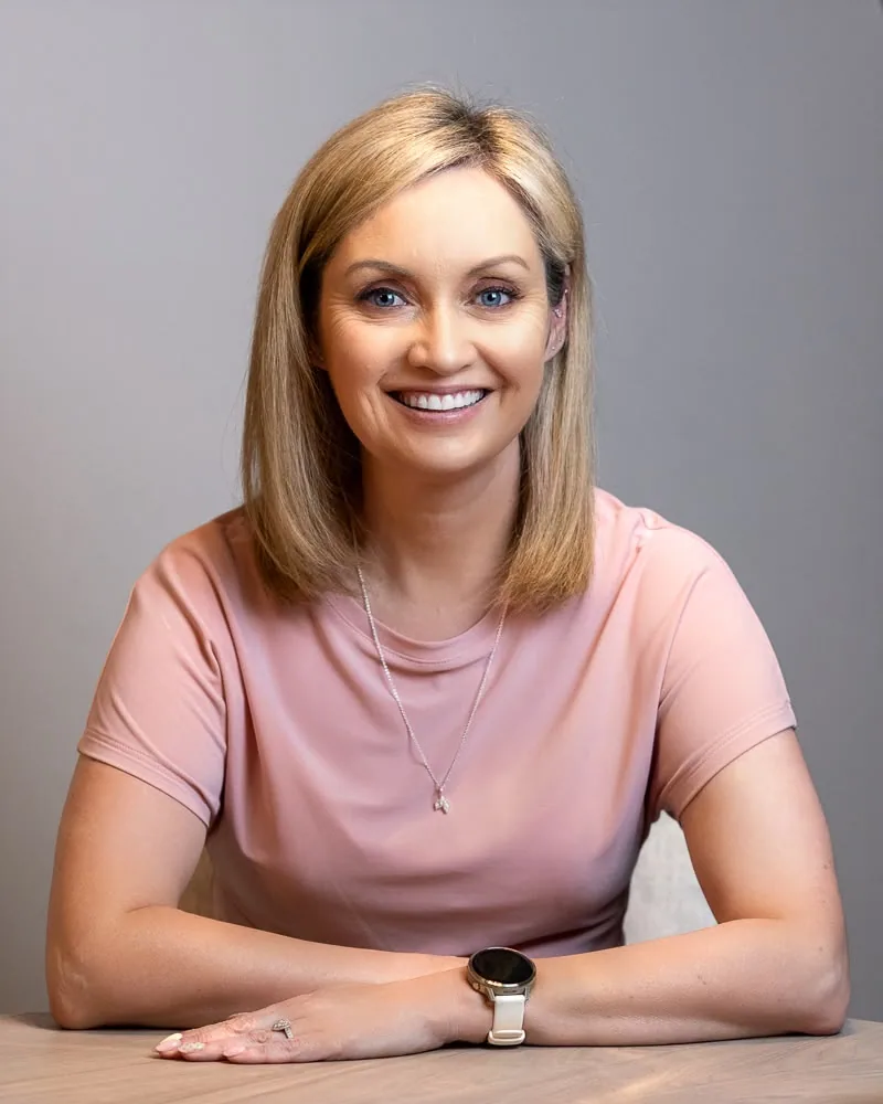 Vicki Casserly smiling at a table